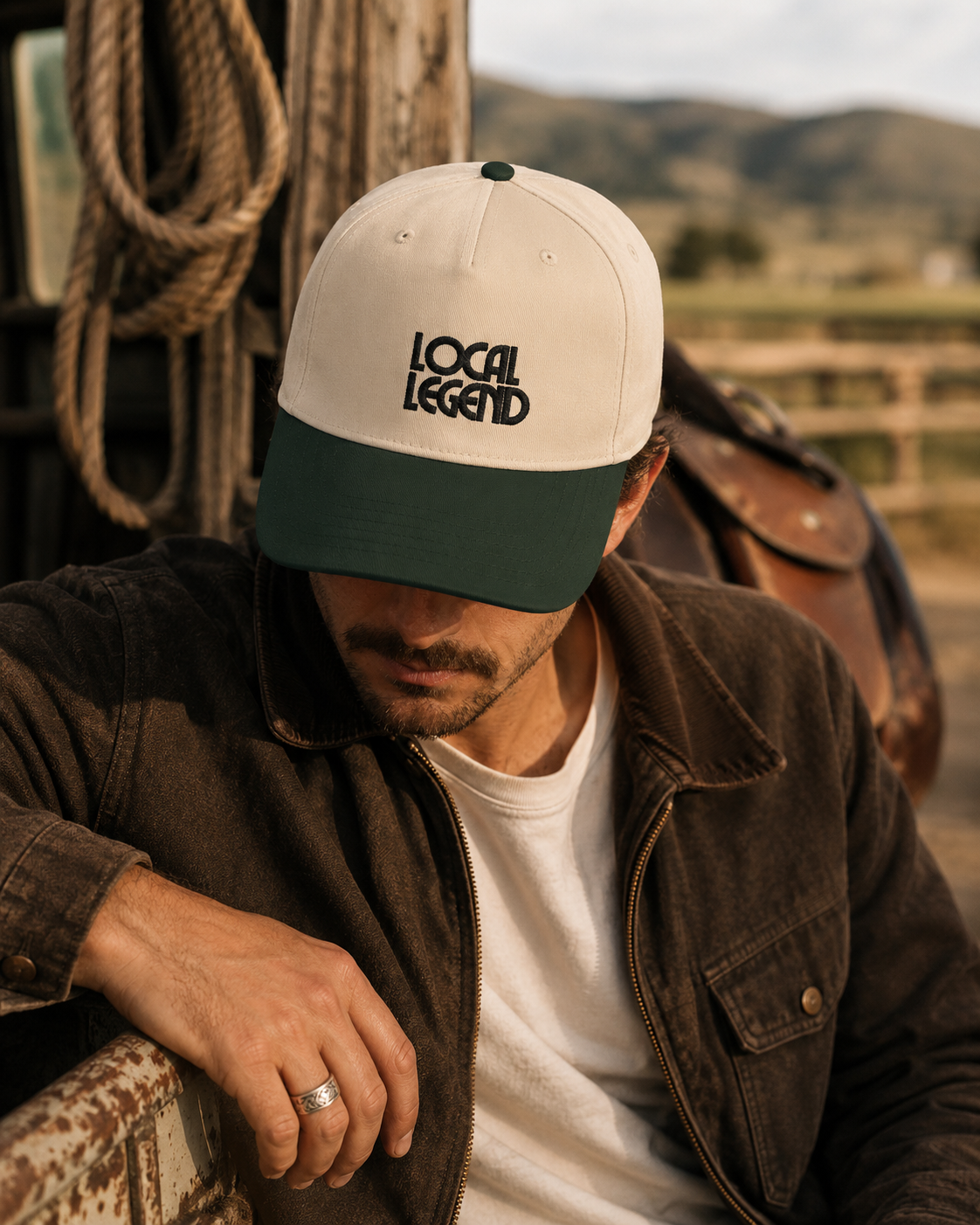 Local Legend embroidered western snapback hat in cream and green with bold black lettering, displayed for western lifestyle apparel.